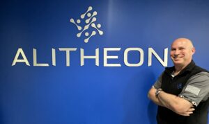 Roei Ganzarski with Alitheon office logo